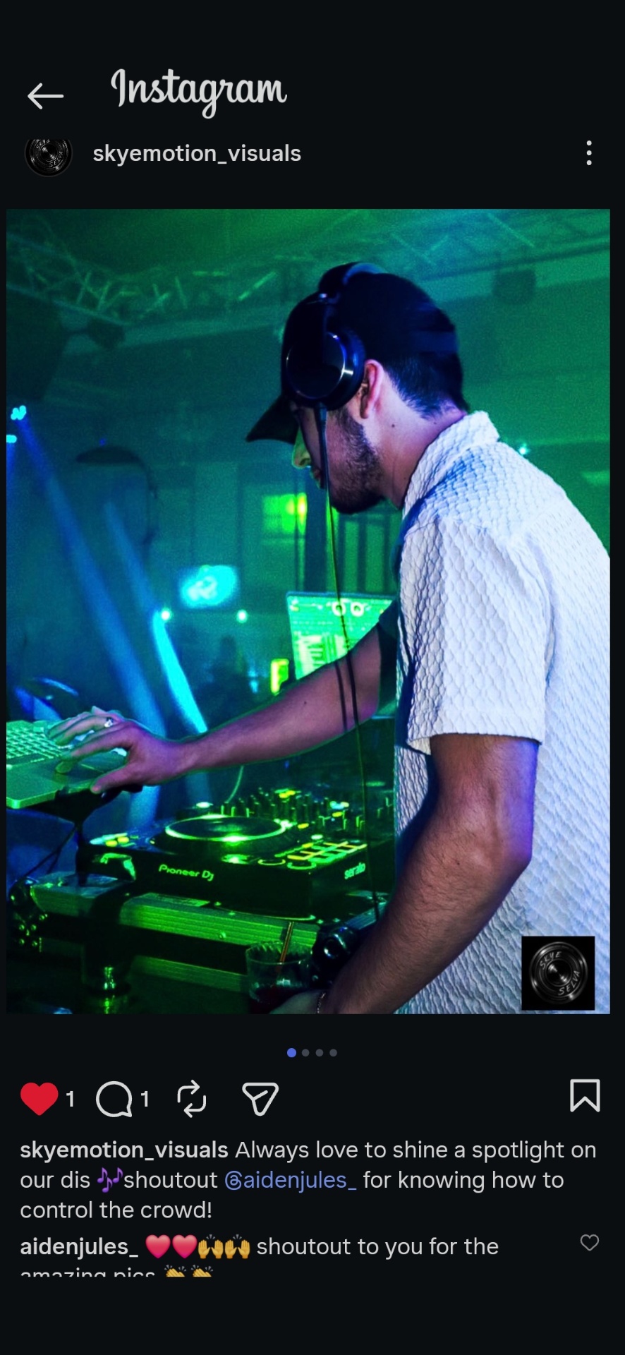 DJ Aiden Jules mixing on Pioneer DJ equipment under green stage lighting at a nightlife event