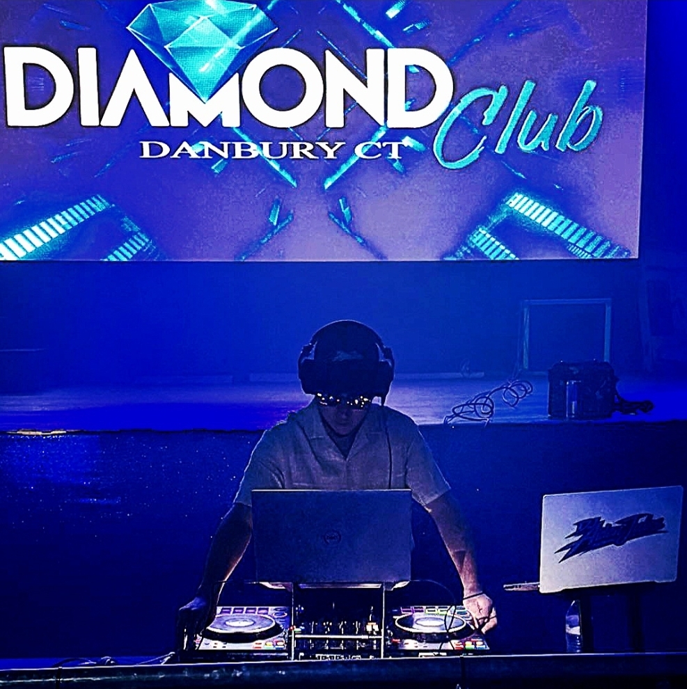 DJ Aiden Jules performing at a nightclub event